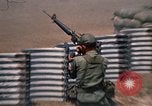 Image of Vietnamese forces firing M-16s in live fire exercise Vietnam, 1970, second 50 stock footage video 65675032685