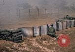 Image of Vietnamese forces firing M-16s in live fire exercise Vietnam, 1970, second 53 stock footage video 65675032685