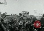 Image of Viet Cong watching U.S. soldiers in Jeep Vietnam, 1965, second 6 stock footage video 65675032686