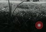 Image of Viet Cong watching U.S. soldiers in Jeep Vietnam, 1965, second 17 stock footage video 65675032686