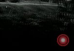 Image of Viet Cong watching U.S. soldiers in Jeep Vietnam, 1965, second 20 stock footage video 65675032686