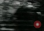 Image of Viet Cong watching U.S. soldiers in Jeep Vietnam, 1965, second 24 stock footage video 65675032686
