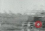 Image of Viet Cong watching U.S. soldiers in Jeep Vietnam, 1965, second 25 stock footage video 65675032686