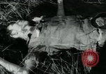 Image of Viet Cong watching U.S. soldiers in Jeep Vietnam, 1965, second 27 stock footage video 65675032686