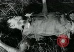 Image of Viet Cong watching U.S. soldiers in Jeep Vietnam, 1965, second 30 stock footage video 65675032686