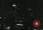 Image of Vietnamese people leaving a damaged Viet Cong camp Vietnam, 1965, second 5 stock footage video 65675032689