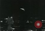 Image of Vietnamese people leaving a damaged Viet Cong camp Vietnam, 1965, second 7 stock footage video 65675032689