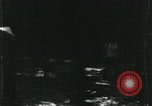 Image of Vietnamese people leaving a damaged Viet Cong camp Vietnam, 1965, second 8 stock footage video 65675032689