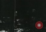 Image of Vietnamese people leaving a damaged Viet Cong camp Vietnam, 1965, second 9 stock footage video 65675032689