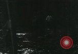Image of Vietnamese people leaving a damaged Viet Cong camp Vietnam, 1965, second 10 stock footage video 65675032689