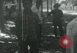Image of Vietnamese people leaving a damaged Viet Cong camp Vietnam, 1965, second 13 stock footage video 65675032689