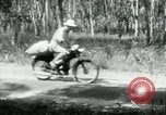 Image of Vietnamese people leaving a damaged Viet Cong camp Vietnam, 1965, second 18 stock footage video 65675032689