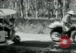 Image of Vietnamese people leaving a damaged Viet Cong camp Vietnam, 1965, second 19 stock footage video 65675032689