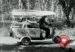 Image of Vietnamese people leaving a damaged Viet Cong camp Vietnam, 1965, second 21 stock footage video 65675032689
