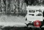 Image of Vietnamese people leaving a damaged Viet Cong camp Vietnam, 1965, second 22 stock footage video 65675032689