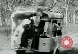 Image of Vietnamese people leaving a damaged Viet Cong camp Vietnam, 1965, second 25 stock footage video 65675032689