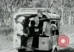 Image of Vietnamese people leaving a damaged Viet Cong camp Vietnam, 1965, second 26 stock footage video 65675032689