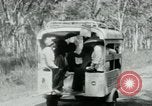 Image of Vietnamese people leaving a damaged Viet Cong camp Vietnam, 1965, second 27 stock footage video 65675032689