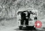 Image of Vietnamese people leaving a damaged Viet Cong camp Vietnam, 1965, second 28 stock footage video 65675032689