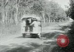 Image of Vietnamese people leaving a damaged Viet Cong camp Vietnam, 1965, second 30 stock footage video 65675032689