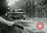 Image of Vietnamese people leaving a damaged Viet Cong camp Vietnam, 1965, second 32 stock footage video 65675032689