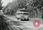 Image of Vietnamese people leaving a damaged Viet Cong camp Vietnam, 1965, second 35 stock footage video 65675032689