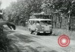 Image of Vietnamese people leaving a damaged Viet Cong camp Vietnam, 1965, second 36 stock footage video 65675032689