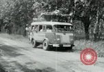 Image of Vietnamese people leaving a damaged Viet Cong camp Vietnam, 1965, second 38 stock footage video 65675032689