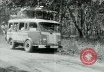 Image of Vietnamese people leaving a damaged Viet Cong camp Vietnam, 1965, second 39 stock footage video 65675032689