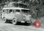Image of Vietnamese people leaving a damaged Viet Cong camp Vietnam, 1965, second 40 stock footage video 65675032689