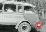 Image of Vietnamese people leaving a damaged Viet Cong camp Vietnam, 1965, second 44 stock footage video 65675032689