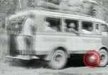 Image of Vietnamese people leaving a damaged Viet Cong camp Vietnam, 1965, second 46 stock footage video 65675032689
