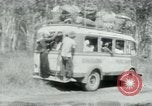 Image of Vietnamese people leaving a damaged Viet Cong camp Vietnam, 1965, second 47 stock footage video 65675032689