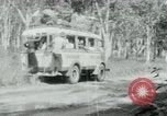 Image of Vietnamese people leaving a damaged Viet Cong camp Vietnam, 1965, second 48 stock footage video 65675032689