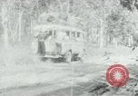 Image of Vietnamese people leaving a damaged Viet Cong camp Vietnam, 1965, second 49 stock footage video 65675032689