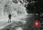 Image of Vietnamese people leaving a damaged Viet Cong camp Vietnam, 1965, second 50 stock footage video 65675032689