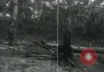 Image of Vietnamese people leaving a damaged Viet Cong camp Vietnam, 1965, second 56 stock footage video 65675032689