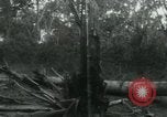Image of Vietnamese people leaving a damaged Viet Cong camp Vietnam, 1965, second 60 stock footage video 65675032689