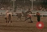 Standbild Rodeo United States USA, 1958, aus Sekunde 54 historischem Filmmaterial Videoclip 65675032784