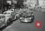 Image of New York City police car driving in midtown Manhattan New York City USA, 1939, second 12 stock footage video 65675032802