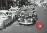 Image of New York City police car driving in midtown Manhattan New York City USA, 1939, second 14 stock footage video 65675032802