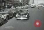 Image of New York City police car driving in midtown Manhattan New York City USA, 1939, second 24 stock footage video 65675032802