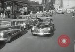Image of New York City police car driving in midtown Manhattan New York City USA, 1939, second 25 stock footage video 65675032802
