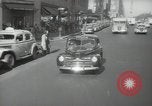 Image of New York City police car driving in midtown Manhattan New York City USA, 1939, second 27 stock footage video 65675032802
