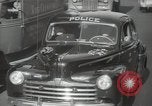 Image of New York City police car driving in midtown Manhattan New York City USA, 1939, second 30 stock footage video 65675032802