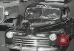 Image of New York City police car driving in midtown Manhattan New York City USA, 1939, second 31 stock footage video 65675032802