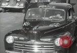 Image of New York City police car driving in midtown Manhattan New York City USA, 1939, second 34 stock footage video 65675032802