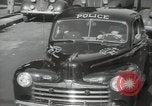 Image of New York City police car driving in midtown Manhattan New York City USA, 1939, second 35 stock footage video 65675032802