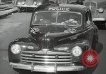 Image of New York City police car driving in midtown Manhattan New York City USA, 1939, second 36 stock footage video 65675032802