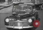 Image of New York City police car driving in midtown Manhattan New York City USA, 1939, second 38 stock footage video 65675032802